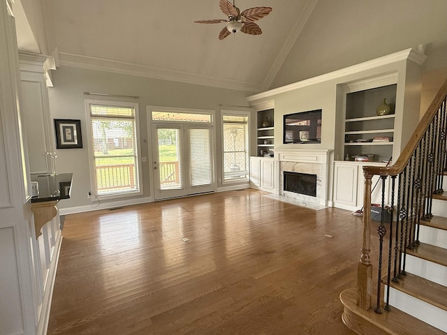 1413 Station Four Ln, Old Hickory, TN 37138 - unfurnished living room featuring high vaulted ceiling, built in shelves, a premium fireplace, stairway, and a ceiling fan