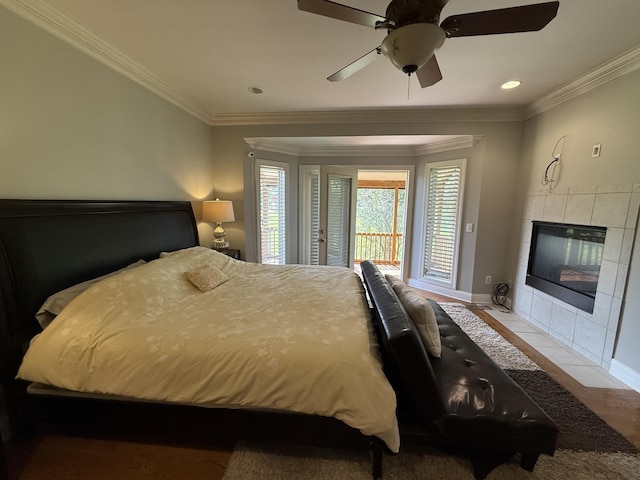 1413 Station Four Ln, Old Hickory, TN 37138 - bedroom featuring access to exterior, a tile fireplace, crown molding, ceiling fan, and recessed lighting