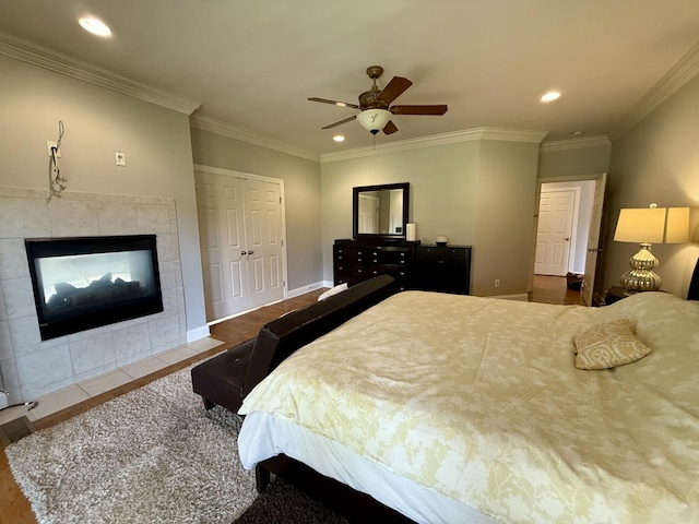 1413 Station Four Ln, Old Hickory, TN 37138 - bedroom featuring wood finished floors, a fireplace, recessed lighting, crown molding, and a ceiling fan