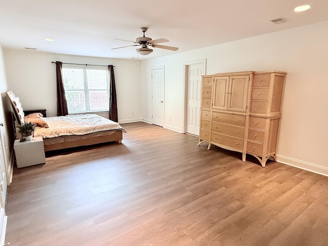 1413 Station Four Ln, Old Hickory, TN 37138 - bedroom with light wood-type flooring, ceiling fan, recessed lighting, and two closets