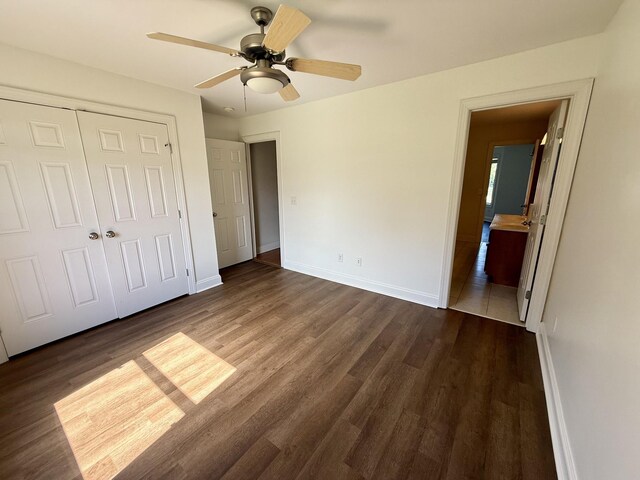 1413 Station Four Ln, Old Hickory, TN 37138 - unfurnished bedroom featuring dark wood-type flooring, a closet, ensuite bathroom, and ceiling fan