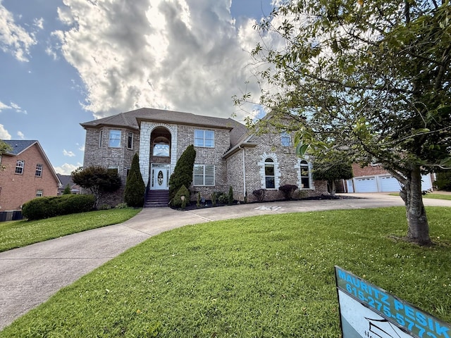 1413 Station Four Ln, Old Hickory, TN 37138 - view of front facade featuring a front lawn, curved driveway, and brick siding