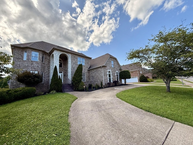 1413 Station Four Ln, Old Hickory, TN 37138 - view of front of home featuring brick siding, a front lawn, and driveway