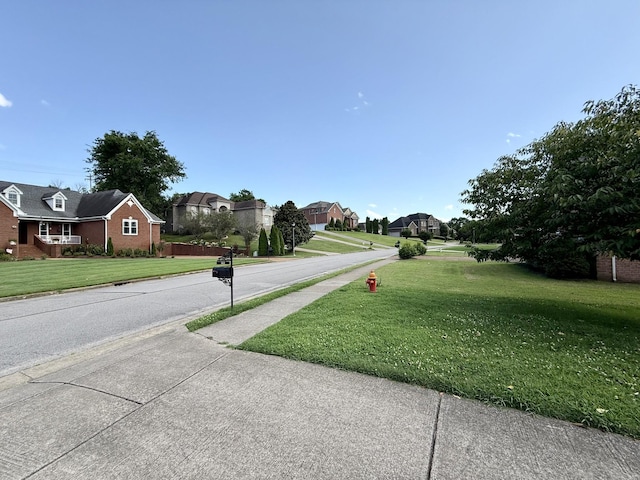 1413 Station Four Ln, Old Hickory, TN 37138 - view of asphalt road with sidewalks, a residential view, and curbs