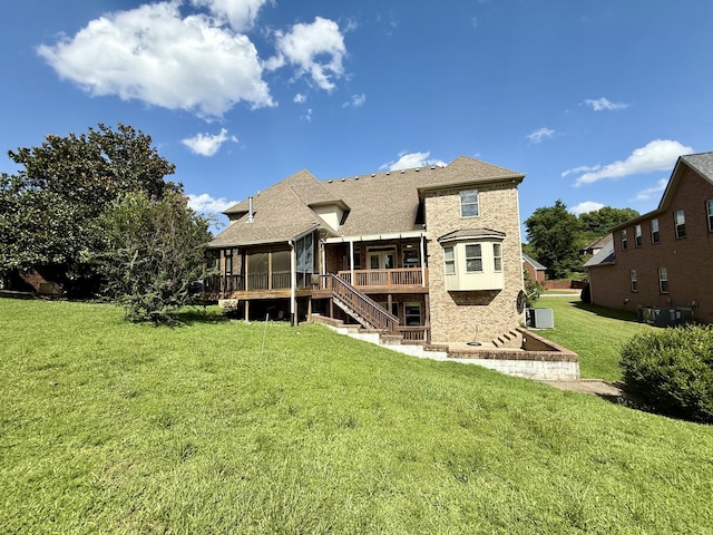 1413 Station Four Ln, Old Hickory, TN 37138 - back of house with a sunroom, stairway, a lawn, and a deck