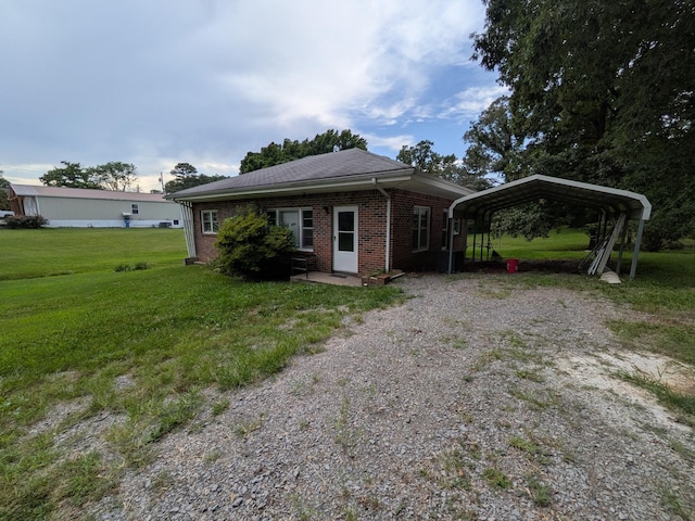 3007 Green Hill Dr, Centerville, TN 37033 - view of front of home with a detached carport, brick siding, a front lawn, and driveway