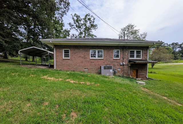 3007 Green Hill Dr, Centerville, TN 37033 - rear view of house featuring a yard, brick siding, and a carport
