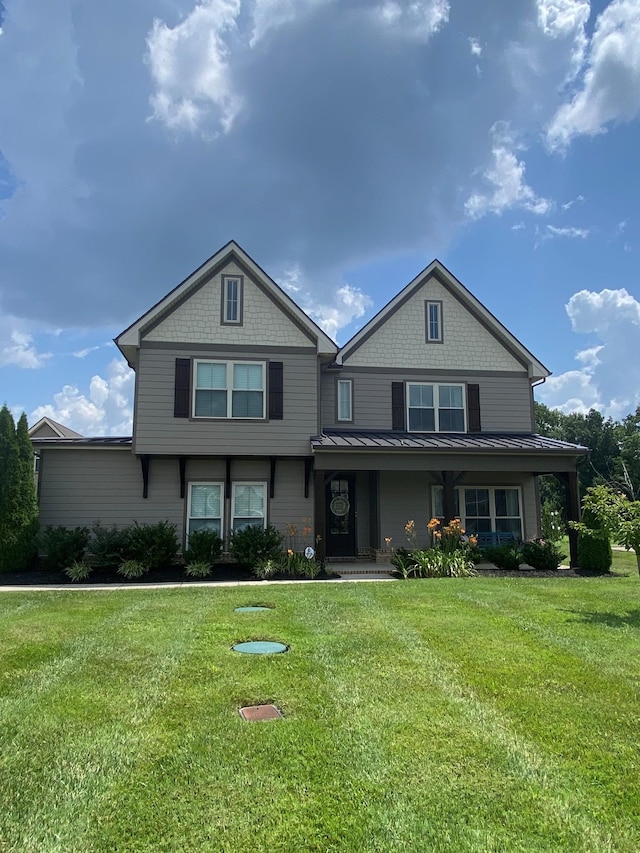2090 Trout Trl, Murfreesboro, TN 37129 - view of front of house with a standing seam roof, a front yard, a metal roof, and covered porch