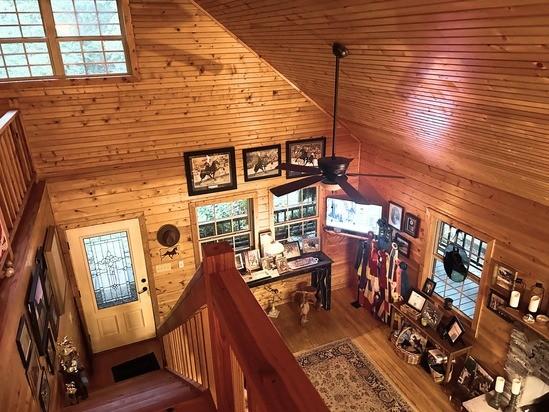 2933 Vanzant Bend Rd, Belvidere, TN 37306 - stairs featuring wood walls, high vaulted ceiling, a ceiling fan, wood finished floors, and wooden ceiling