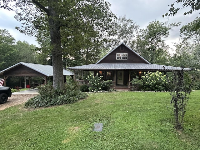 2933 Vanzant Bend Rd, Belvidere, TN 37306 - farmhouse inspired home with a front yard, covered porch, driveway, a metal roof, and an attached carport