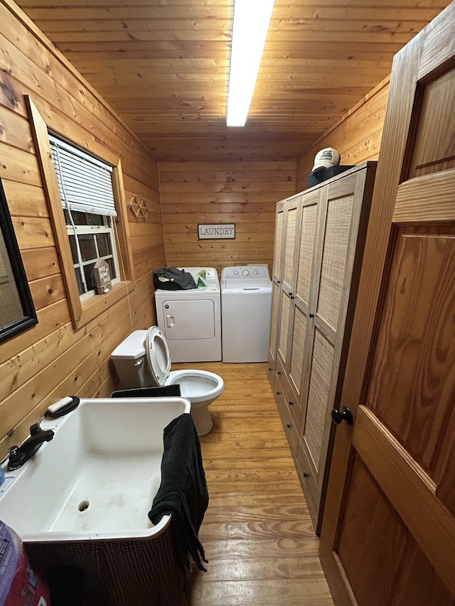 2933 Vanzant Bend Rd, Belvidere, TN 37306 - laundry room with washing machine and dryer, wooden walls, light wood-style floors, and wood ceiling