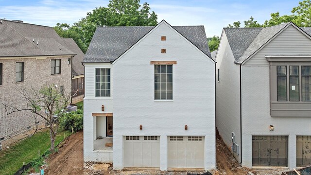 4155 Outer Dr, Nashville, TN 37204 - rear view of house featuring a garage and brick siding