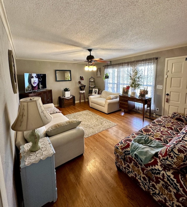 6191 Baxter Rd, Baxter, TN 38544 - living area featuring a textured ceiling, ceiling fan, wood finished floors, and ornamental molding