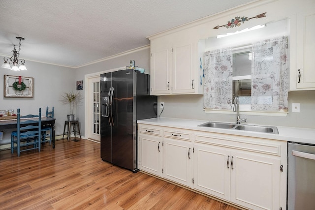 6191 Baxter Rd, Baxter, TN 38544 - kitchen featuring refrigerator with ice dispenser, stainless steel dishwasher, light countertops, light wood-style flooring, and pendant lighting