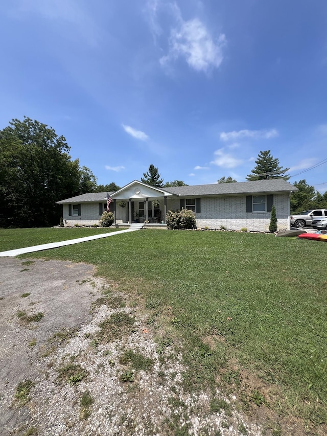 6191 Baxter Rd, Baxter, TN 38544 - ranch-style home featuring a front lawn