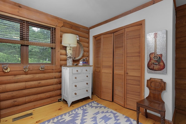 1261 S Cedar Ln, Chickamauga, GA 30707 - bedroom featuring log walls, light wood finished floors, and a closet