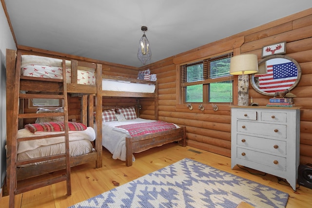 1261 S Cedar Ln, Chickamauga, GA 30707 - bedroom with rustic walls and hardwood / wood-style flooring