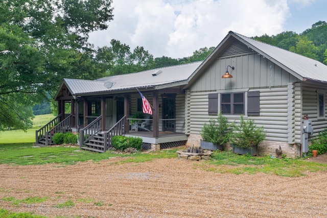 1261 S Cedar Ln, Chickamauga, GA 30707 - view of front of property featuring a metal roof, covered porch, board and batten siding, and log exterior