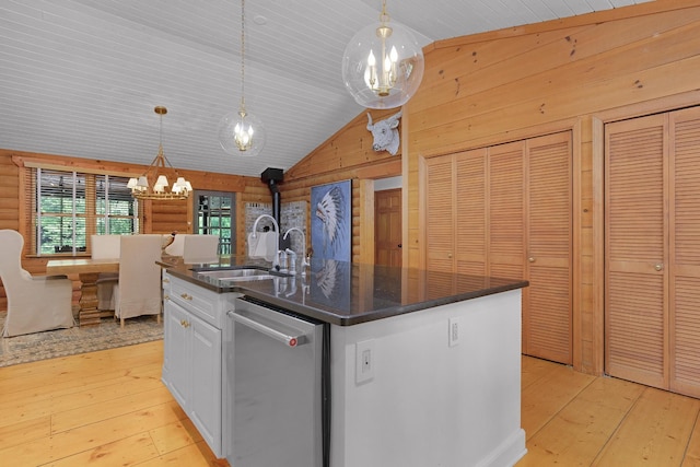 1261 S Cedar Ln, Chickamauga, GA 30707 - kitchen with dishwasher, a chandelier, light wood-style flooring, white cabinetry, and wood walls