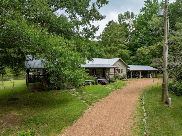 1261 S Cedar Ln, Chickamauga, GA 30707 - view of front of property featuring driveway, a front lawn, a carport, a metal roof, and a porch