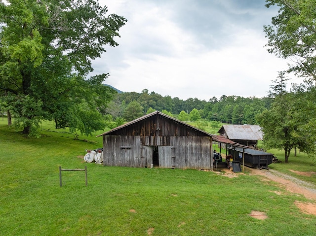 1261 S Cedar Ln, Chickamauga, GA 30707 - view of outdoor structure featuring driveway and a forest view