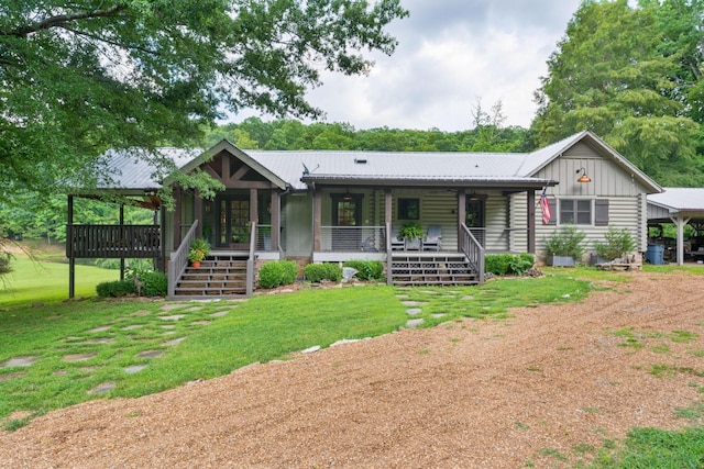 1261 S Cedar Ln, Chickamauga, GA 30707 - ranch-style house with driveway, a front yard, stairway, a porch, and a metal roof