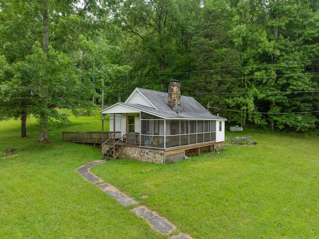 1261 S Cedar Ln, Chickamauga, GA 30707 - view of green lawn featuring a sunroom, a wooden deck, and a forest view