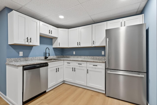 115 Annabelle Way, Ashland City, TN 37015 - kitchen featuring stainless steel appliances, a drop ceiling, light wood finished floors, white cabinetry, and recessed lighting