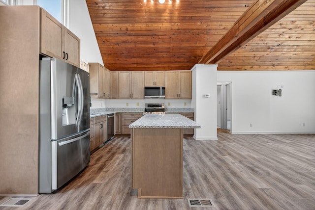 115 Annabelle Way, Ashland City, TN 37015 - kitchen with stainless steel appliances, vaulted ceiling, wood ceiling, a center island, and light stone countertops