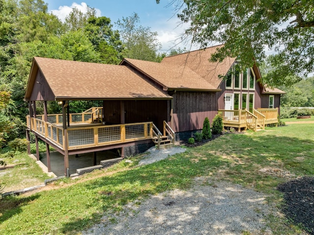 115 Annabelle Way, Ashland City, TN 37015 - back of house with roof with shingles, a wooden deck, and a yard
