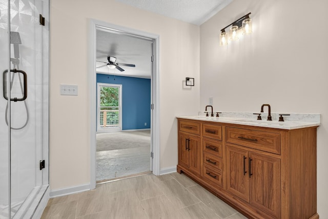 115 Annabelle Way, Ashland City, TN 37015 - bathroom featuring a ceiling fan, a shower stall, and double vanity