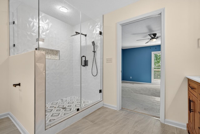 115 Annabelle Way, Ashland City, TN 37015 - bathroom featuring vanity, a shower stall, ceiling fan, and a textured ceiling