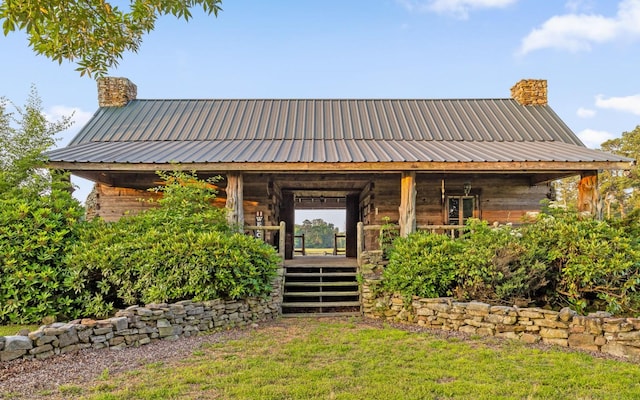 36 Still Hollow Rd, Menlo, GA 30731 - view of front of home featuring a chimney, a metal roof, and a front yard