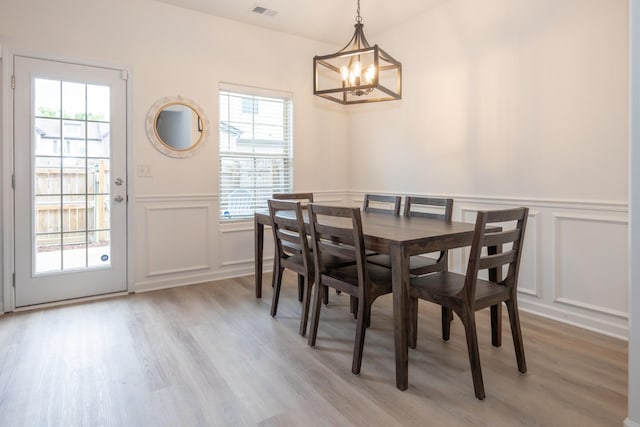 5314 Dan Post Way, Murfreesboro, TN 37128 - dining area with a decorative wall, a chandelier, light wood-style flooring, plenty of natural light, and a wainscoted wall