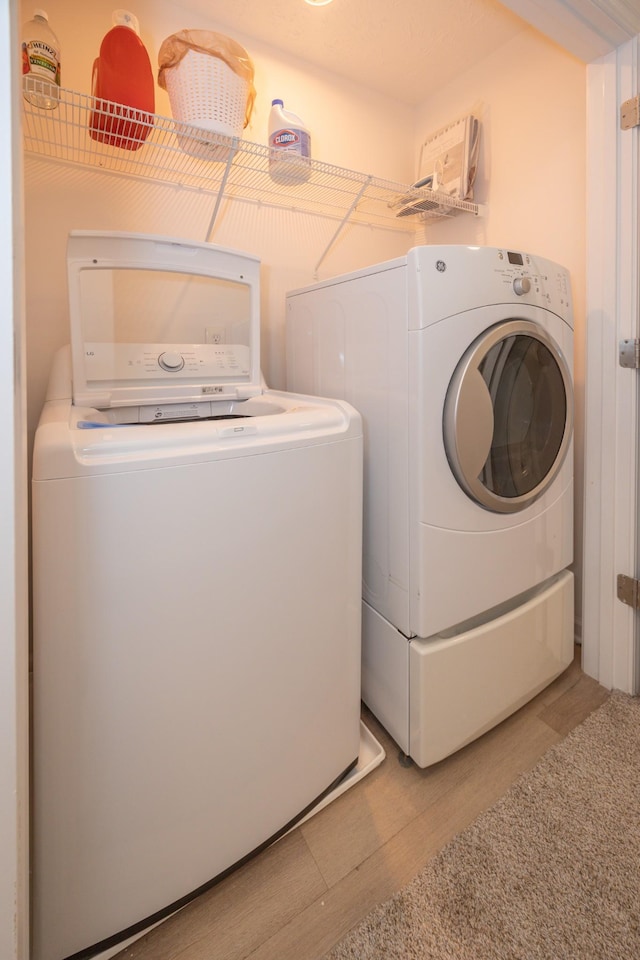 5314 Dan Post Way, Murfreesboro, TN 37128 - laundry room with washing machine and clothes dryer and light wood-style floors