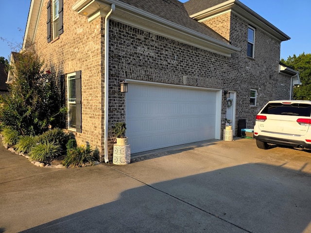 8009 Shelly Plum Dr, Murfreesboro, TN 37128 - view of home's exterior with concrete driveway, brick siding, and a garage