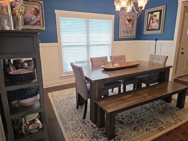 8009 Shelly Plum Dr, Murfreesboro, TN 37128 - dining space with a wainscoted wall, a chandelier, a decorative wall, and wood finished floors