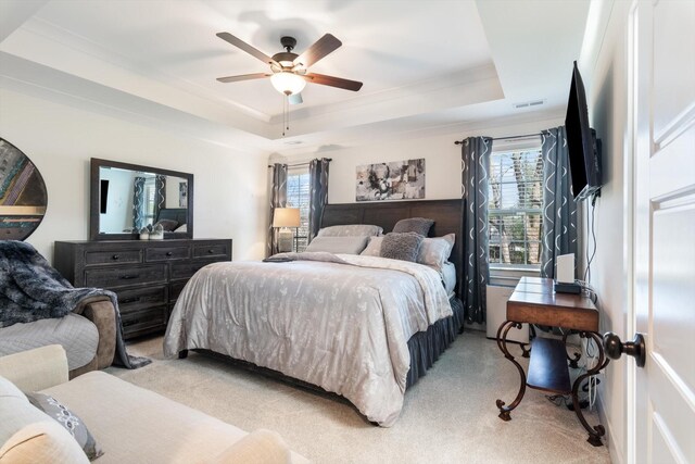 3331 Alta Ln, Murfreesboro, TN 37128 - bedroom featuring a tray ceiling, light colored carpet, multiple windows, and a ceiling fan