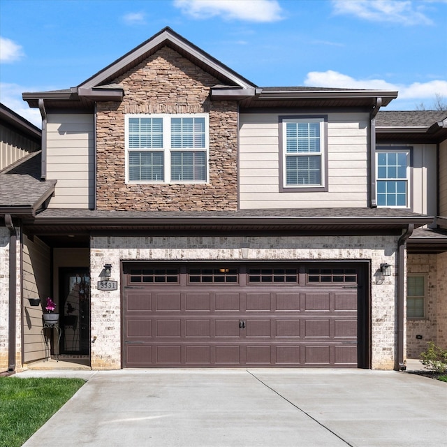 3331 Alta Ln, Murfreesboro, TN 37128 - view of property with an attached garage, concrete driveway, and stone siding