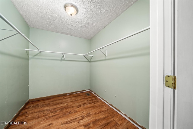 708 Poston Dr, Monterey, TN 38574 - walk in closet featuring wood finished floors