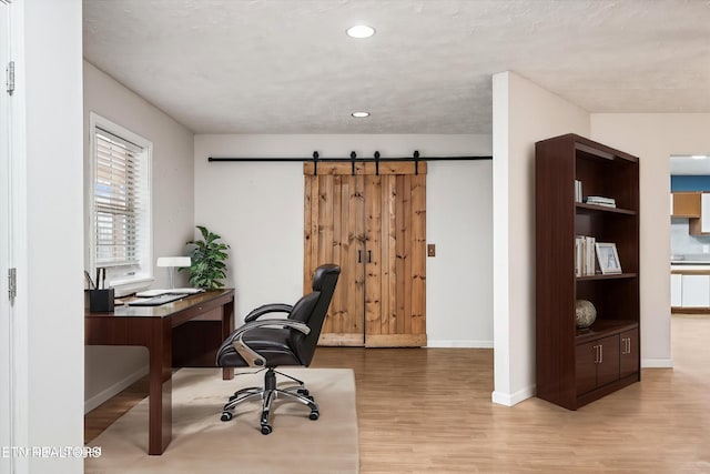 708 Poston Dr, Monterey, TN 38574 - home office featuring wood finished floors, a barn door, and recessed lighting