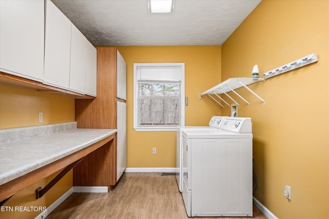 708 Poston Dr, Monterey, TN 38574 - laundry room with cabinet space, separate washer and dryer, light wood-type flooring, and a textured ceiling