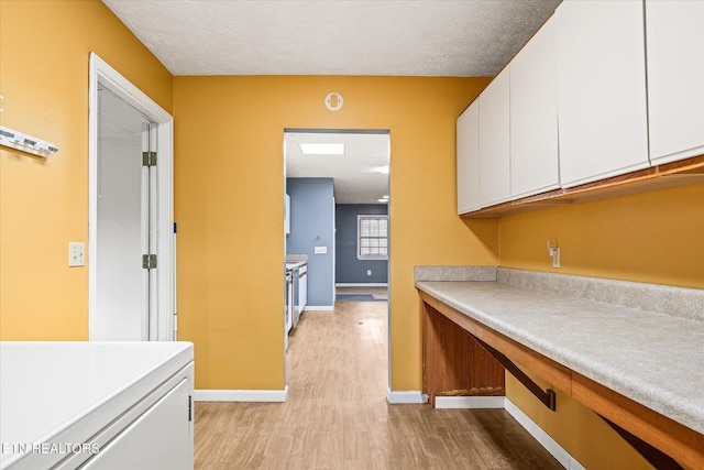 708 Poston Dr, Monterey, TN 38574 - kitchen featuring white cabinets, light wood finished floors, and light countertops