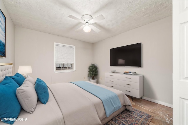 708 Poston Dr, Monterey, TN 38574 - bedroom with light wood-style floors, ceiling fan, and a textured ceiling