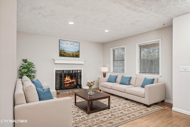 708 Poston Dr, Monterey, TN 38574 - living area with wood finished floors, a brick fireplace, and recessed lighting