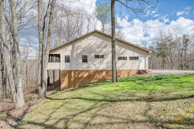708 Poston Dr, Monterey, TN 38574 - view of property exterior with entry steps, a yard, and a detached garage