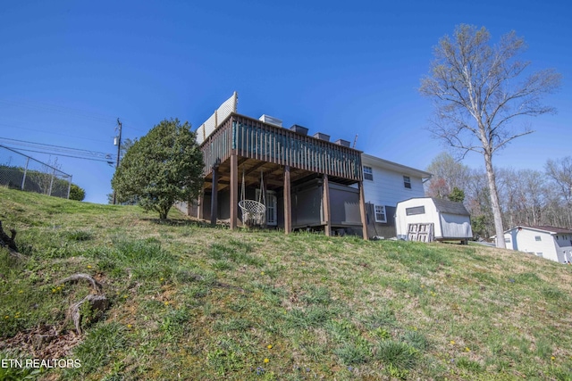 8114 Sharp Rd, Powell, TN 37849 - rear view of property with a deck, a lawn, and a shed