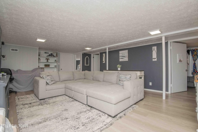 8114 Sharp Rd, Powell, TN 37849 - living room featuring wood finished floors and a textured ceiling