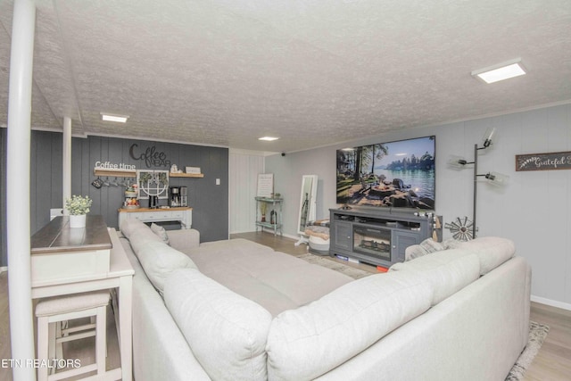 8114 Sharp Rd, Powell, TN 37849 - living area with wood finished floors and a textured ceiling