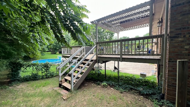 712 Rossview Rd, Clarksville, TN 37043 - view of play area with a wooden deck, a pergola, stairs, a lawn, and an outdoor pool